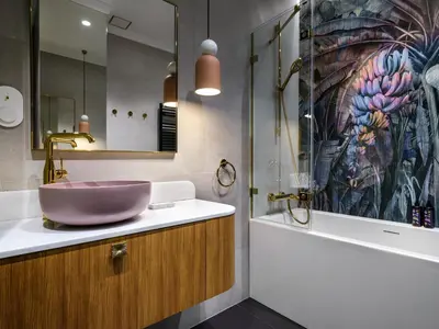 a bathroom with a sink and a large painting on the wall at Wenecja by Tyzenhauz in Kraków