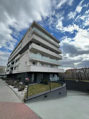 a large apartment building with a fence in front of it at Eleganckie Studio Royal w sercu Krakowa in Kraków