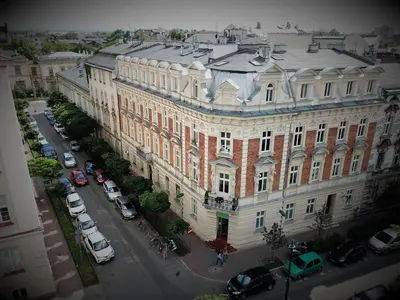 an aerial view of a large building with cars parked outside at Apartamenty Czapskich in Kraków