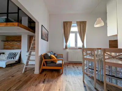 a room with two bunk beds and a couch at Dąbrowskiego 15 by Homeprime in Kraków