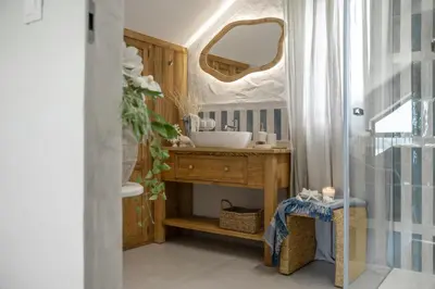 a bathroom with a sink and a mirror at Mucharskie Wzgórze in Mucharz