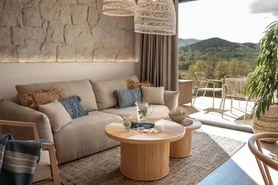 a living room with a couch and a table at Mucharskie Wzgórze in Mucharz