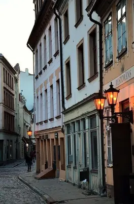 a cobblestone street in a city with buildings at Apartment in the Heart of Krakow - Between the Old Town and Kazimierz District in Kraków