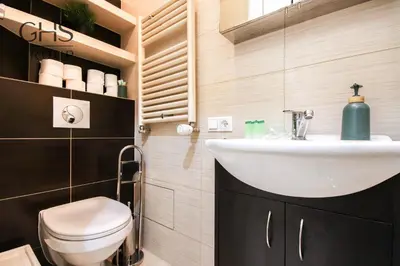 a bathroom with a sink and a toilet at Apartment in the Heart of Krakow - Between the Old Town and Kazimierz District in Kraków