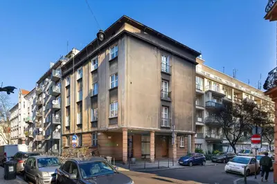 a large building with cars parked in front of it at Bright Apartment Near Old Town and Wawel by Noclegi Renters in Kraków