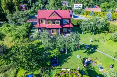 an overhead view of a house with a red roof at Willa Świt in Maków Podhalański