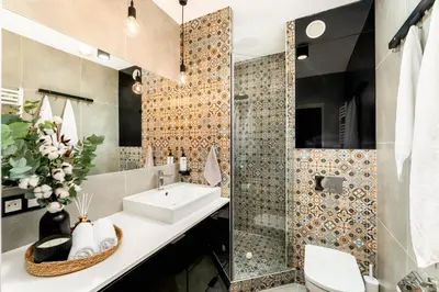 a bathroom with a sink and a shower at Forest House by Cozyplace in Kraków