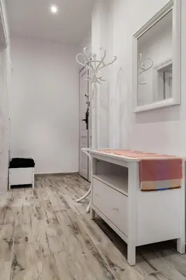 a room with a desk and a mirror on a wall at Househost Apt Starowislna 75-2 in Kraków
