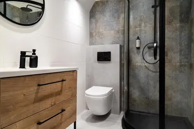 a bathroom with a shower and a toilet and a sink at Househost Apt Starowislna 75-2 in Kraków