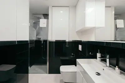 a bathroom with a toilet and a sink and a shower at inQse Krakow Brewery Residence in Kraków