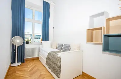 a small room with a bed and a window at InPoint Royal Wawel View & Old Town Apartment Self Check-in in Kraków