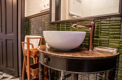 a bathroom with a sink and a mirror at InPoint Royal Wawel View & Old Town Apartment Self Check-in in Kraków