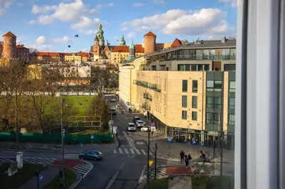 a view of a city street with cars and buildings at InPoint Royal Wawel View & Old Town Apartment Self Check-in in Kraków