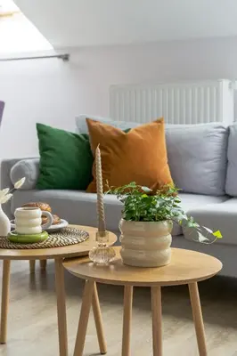 a living room with a couch and a table at Barbakan Loft Old Town in Kraków