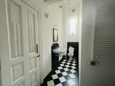 a bathroom with a sink and a toilet at Old Town Apartments 2 in Kraków