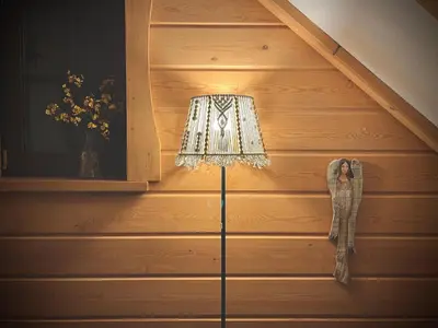 a floor lamp in a room with a wooden wall at Kefasówka in Zawoja