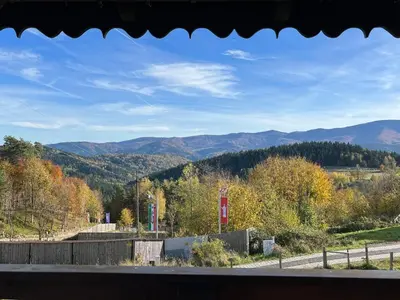 a view of a road with mountains in the background at Kefasówka in Zawoja