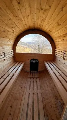 an inside view of a wooden room with a window at Domek z Bali in Zawoja