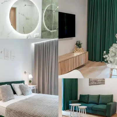 a bedroom with green curtains and a bed and a mirror at K&M Apartments Tauron Arena in Kraków