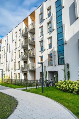 an apartment building with bikes parked outside of it at K&M Apartments Tauron Arena in Kraków