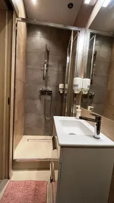 a bathroom with a shower and a sink at Studio in City Center in Kraków