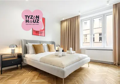 a bedroom with a bed and a sign that reads vegan hawk at Starowiślna by Tyzenhauz in Kraków
