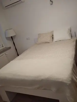 a white bathroom with a shower and a toilet at Apartament przy 29 alei in Kraków