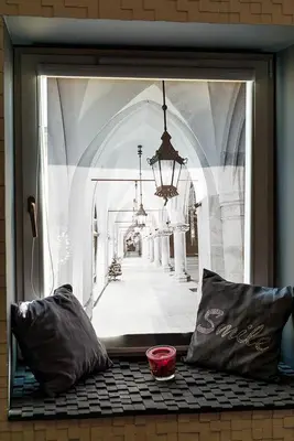 a window with a picture of a hallway in a building at Cozy and Large 62 m2 Apartment with Air Conditioning, Old Town in Kraków