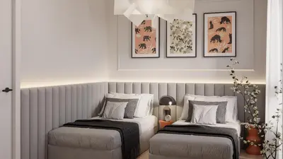 two beds sitting next to each other in a room at Pearl of the city in Kraków