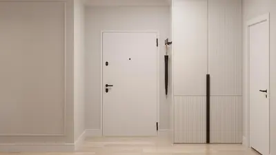 a room with two white cabinets and a door at Pearl of the city in Kraków