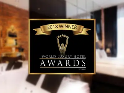 a sign that says world luxury hotel awards at Hotel Betmanowska Main Square Residence Adults Only in Kraków