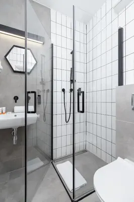 a bathroom with a shower and a sink at Cracow Miodowa 42 Elegant Studios by Noclegi Renters in Kraków