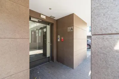 an entrance to a building with a glass door at Cracow Miodowa 42 Elegant Studios by Noclegi Renters in Kraków