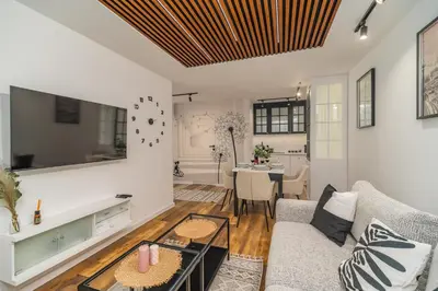 a living room with a couch and a table at Prądnik Biały Apt - Parks Nearby - by Rentujemy in Kraków