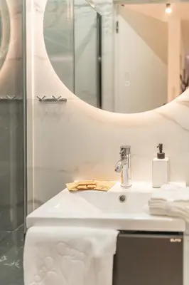 a bathroom with a sink and a mirror at Prądnik Biały Apt - Parks Nearby - by Rentujemy in Kraków