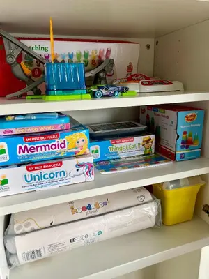 a shelf with toys and other toys on it at No̱410 City View Apartment & free private parking in Kraków