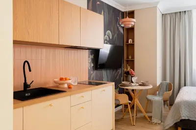 a bowl of oranges on a counter in a kitchen at Red Roof Apartments Old Town in Kraków