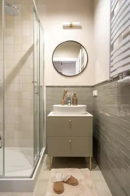a mirror reflection of a bed with a pillow on it at Red Roof Apartments Old Town in Kraków