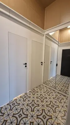 a bedroom with a bed and a mirror at Noce i Dnie in Kraków