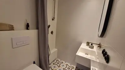 a bathroom with a sink and a toilet at Noce i Dnie in Kraków
