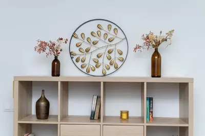 a shelf with two vases and a plate on it at Cystersów Charming Apartment by BookingHost in Kraków
