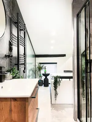 a kitchen with a white counter and potted plants at Apartment Premium Jacuzzi, Old Town Cracow in Kraków
