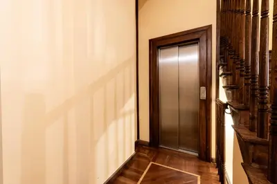 a hallway with a elevator and a door at Św Tomasza Old Town, Sun & Snow in Kraków