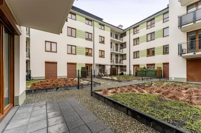 an image of an apartment building with a courtyard at Apartments Deluxe Amsterdam 02 by BookingHost in Kraków