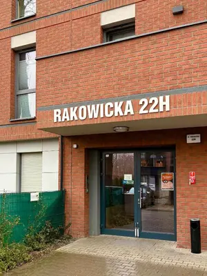 a brick building with a sign that reads rakolnoxinka at Apartamenty Figaretti Rakowicka in Kraków