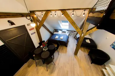 an overhead view of a room with a bed and a table at Pilotow 87 Apartments in Kraków