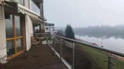 a balcony of a house with a view of a lake at Wisła Sunset in Kraków