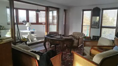 a living room with a table and chairs at Wisła Sunset in Kraków