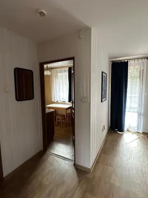 an empty room with a table and a dining room at Ponikiew Resort in Wadowice