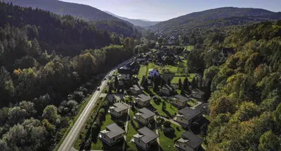 an aerial view of a village in the mountains at Ponikiew Resort in Wadowice